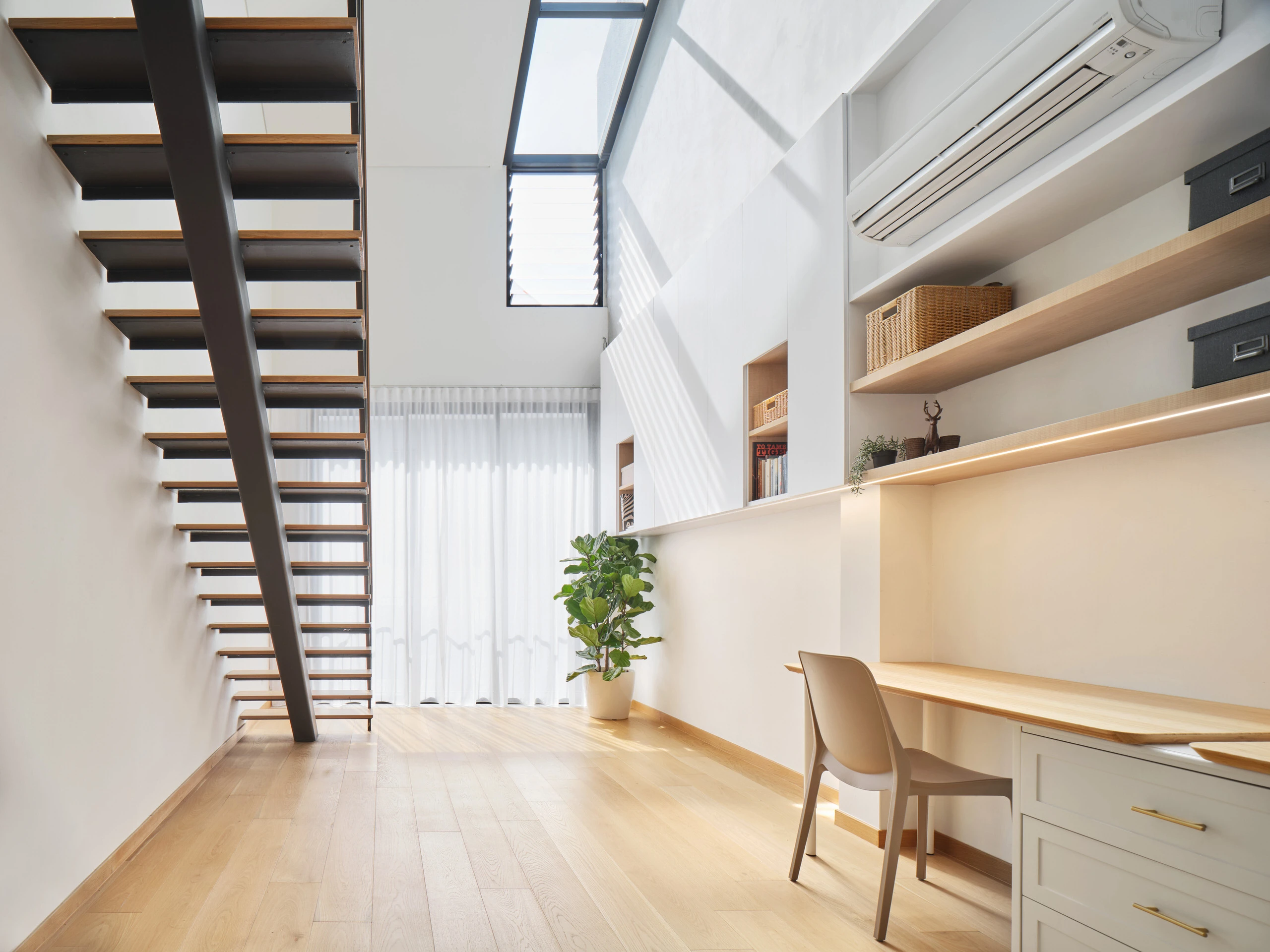 Contemporary staircase and open layout in residential interior design.