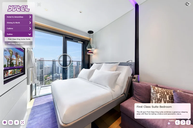 Hotel room virtual tour at Yotel Singapore Orchard showing bedroom with pendant lamps and illuminated city skyline