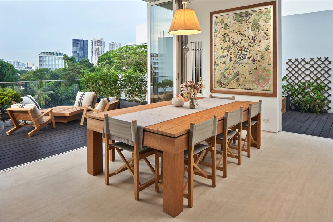 Living area with dining table and large windows