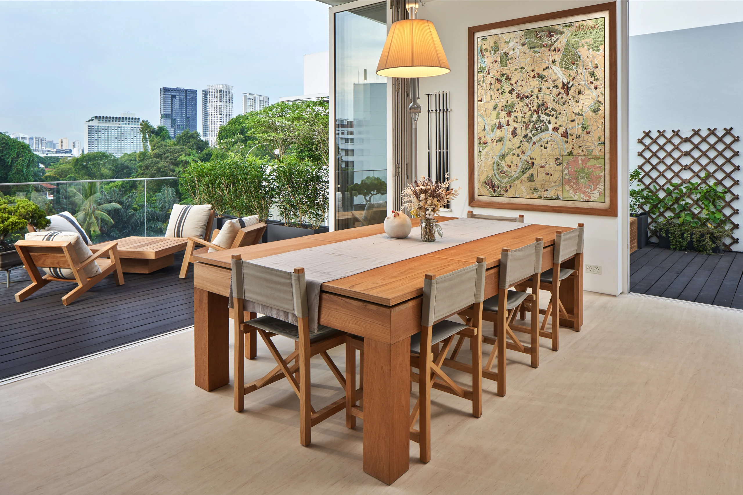 Living area with dining table and large windows