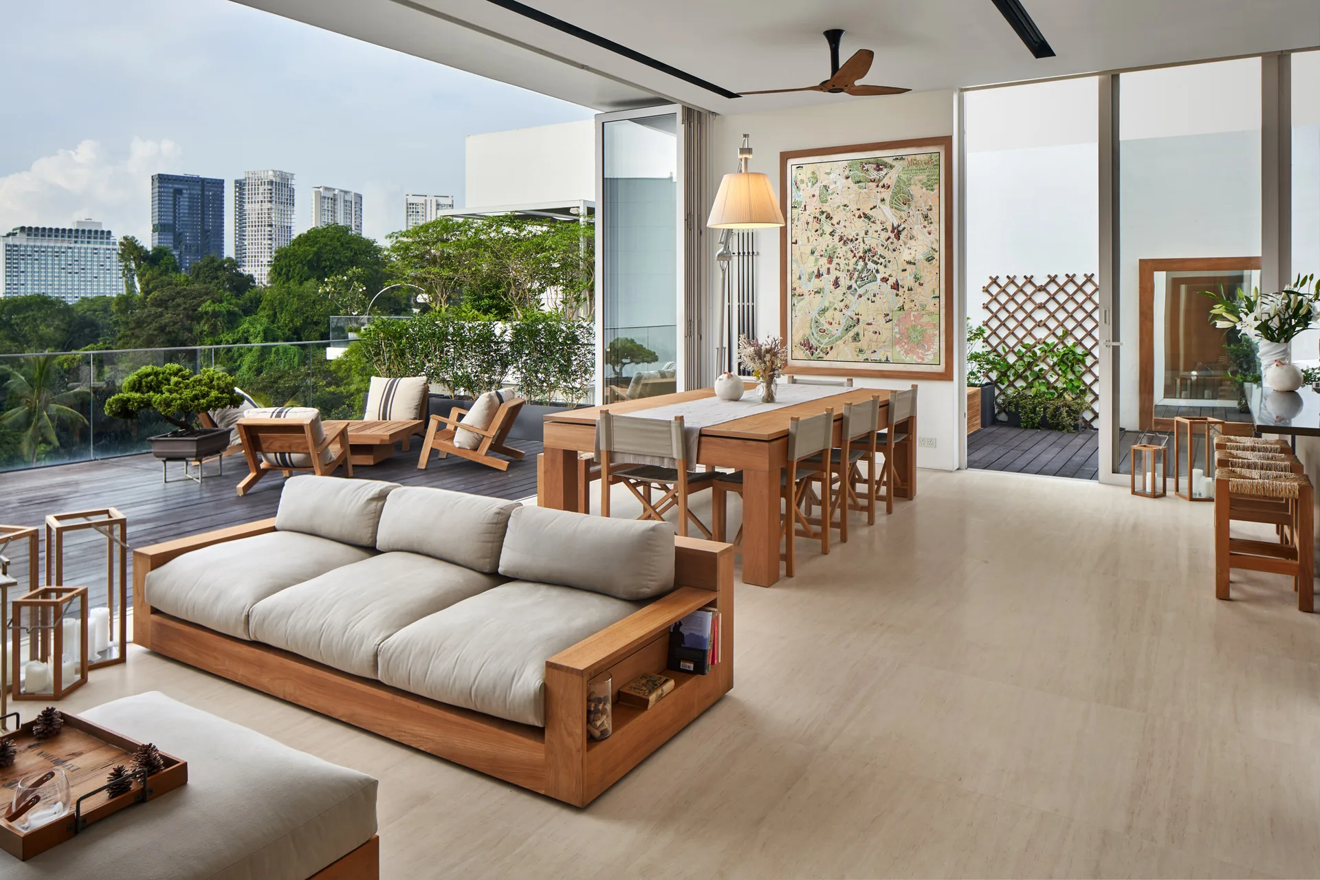 Living area with dining table arrangement and garden views