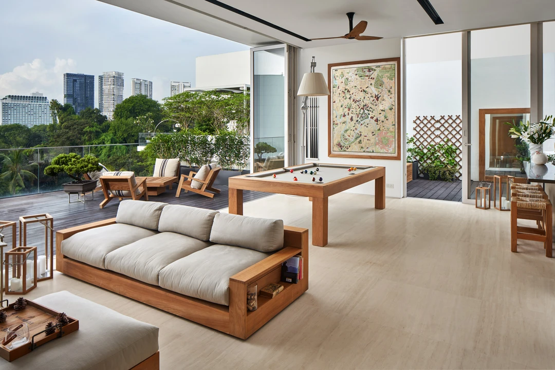 Spacious living area with modern furniture and garden views