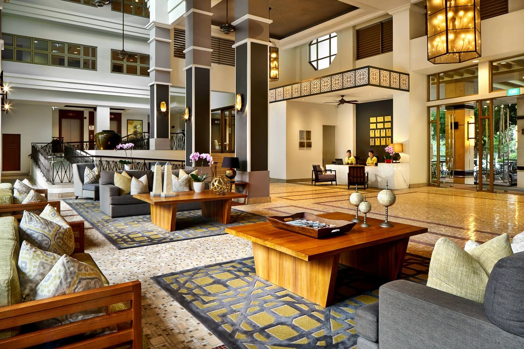 Grand lobby with box-lantern pendants, grey sofas and reception desk - Treetops Executive Residences hospitality photography