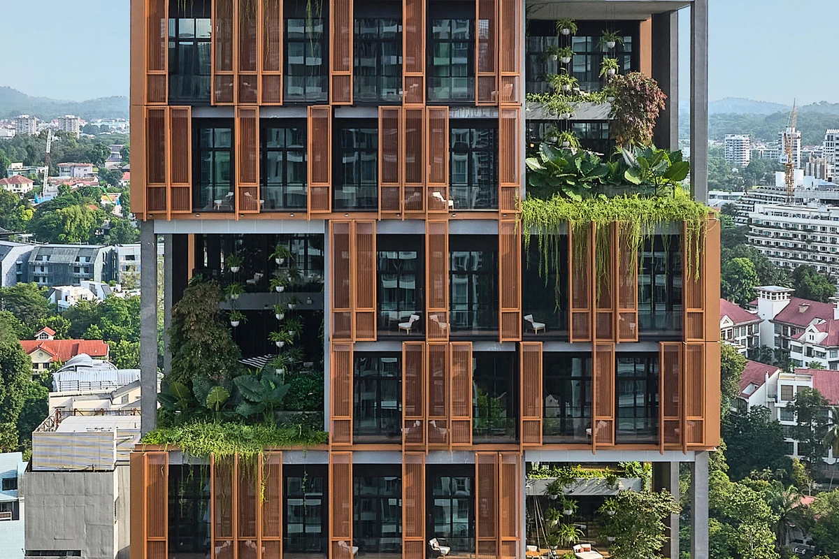Artyzen Hotel Singapore facade detail with copper screens and tropical planting