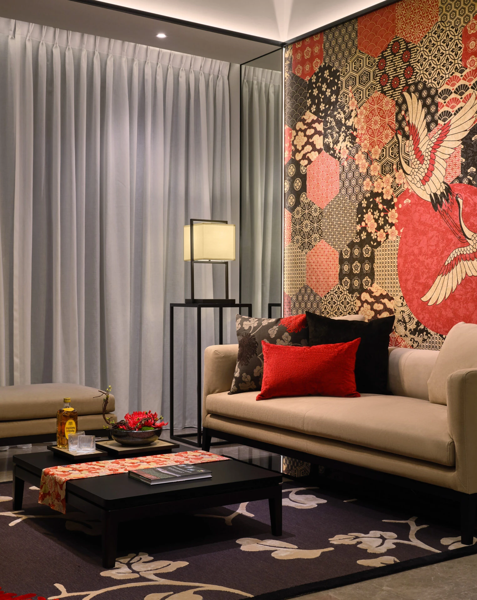 Detail with brocade pillow, spider lily arrangement and warm lamp glow