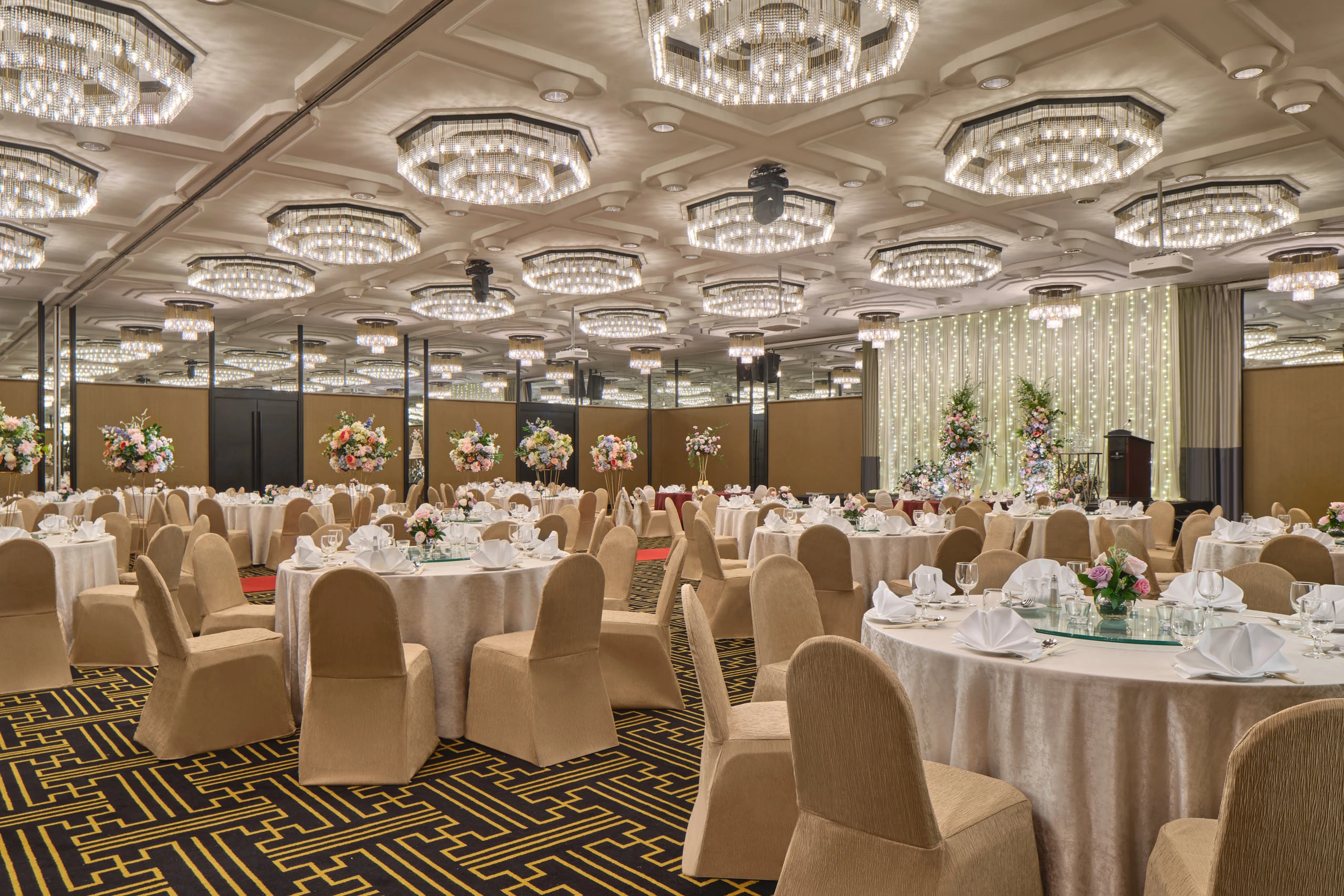 Rosa setup side view with round tables and blush linens