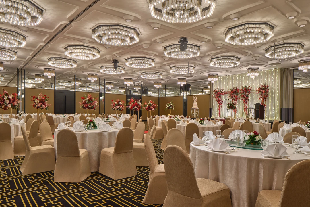 Scarlett setup side view with draped stage and round guest tables
