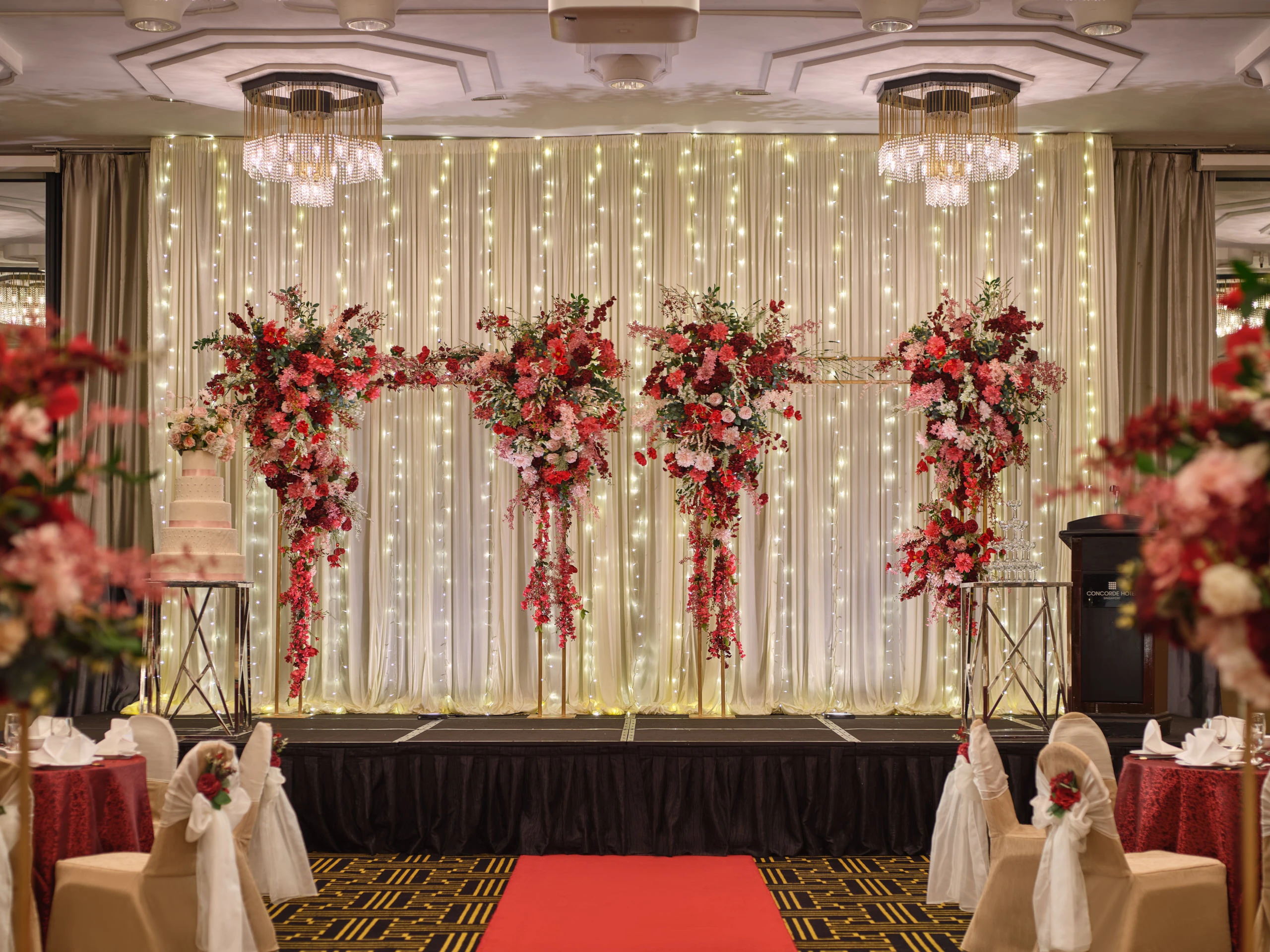 Scarlett stage with draped backdrop and spotlight