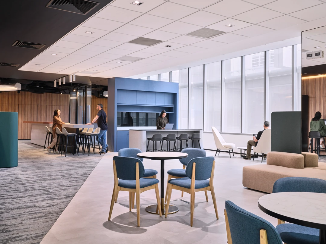 Open-plan collaborative lounge with kitchenette and modular seating