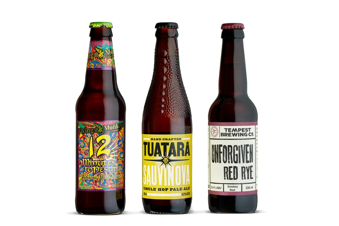 Craft beer bottles on white seamless background with studio lighting