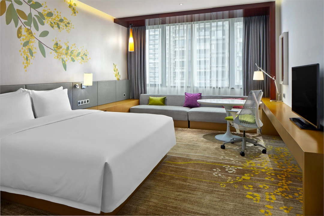 King room with botanical mural, daybed and pendant sconces