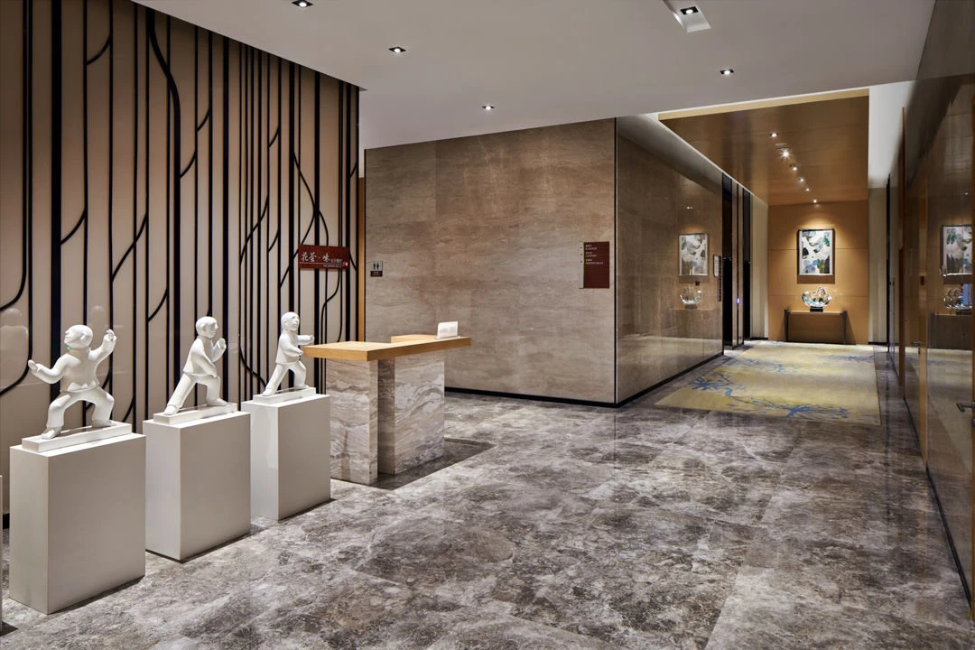 Restaurant entrance with porcelain sculptures and slatted accent wall
