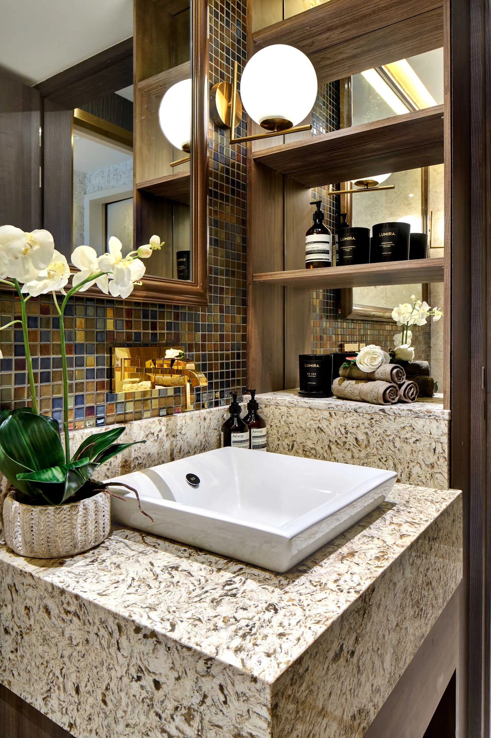 Elegant powder room with stone countertop and modern sink