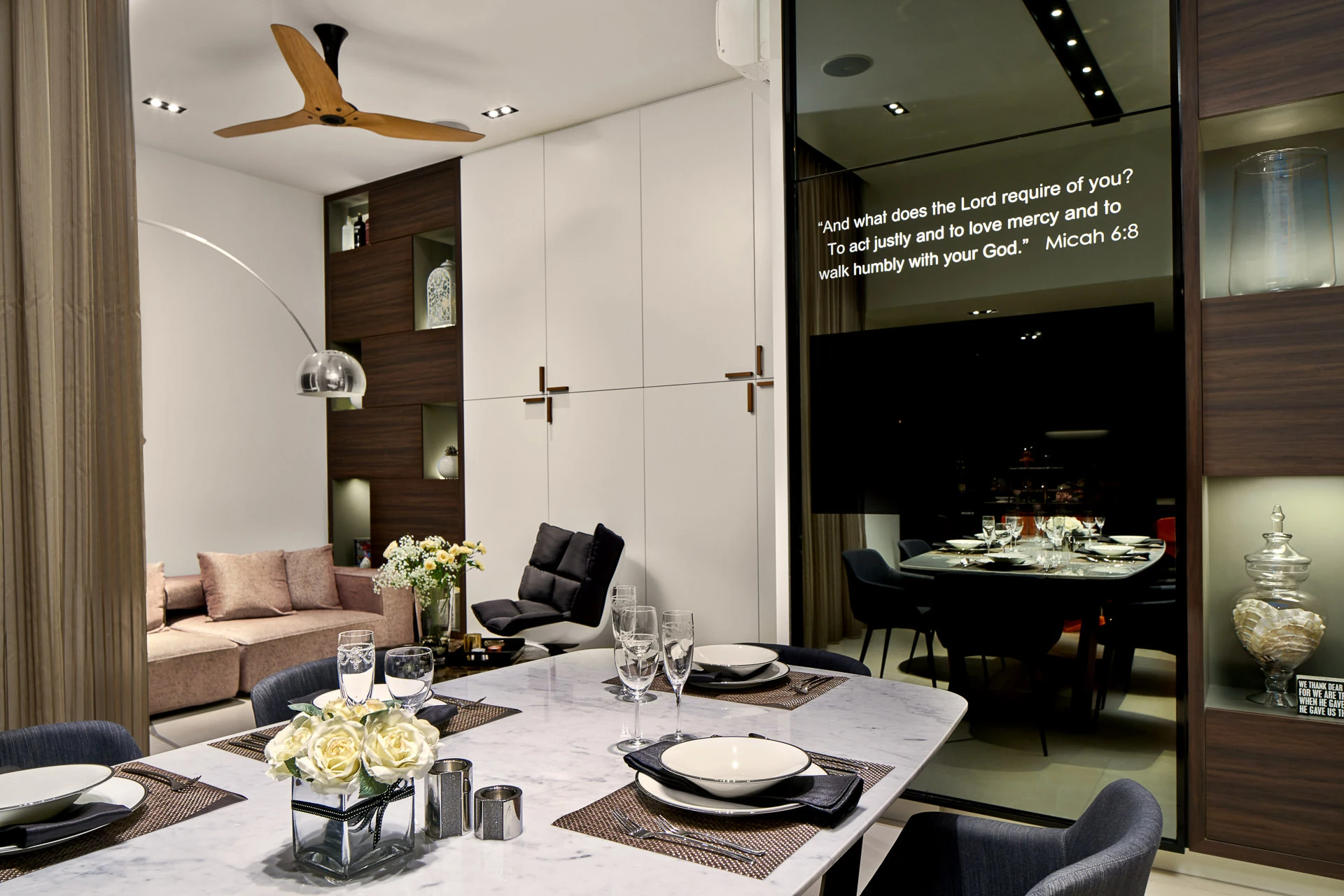 Open-plan dining with marble table, walnut feature wall and arc lamp — Simei Rise Singapore interior photography