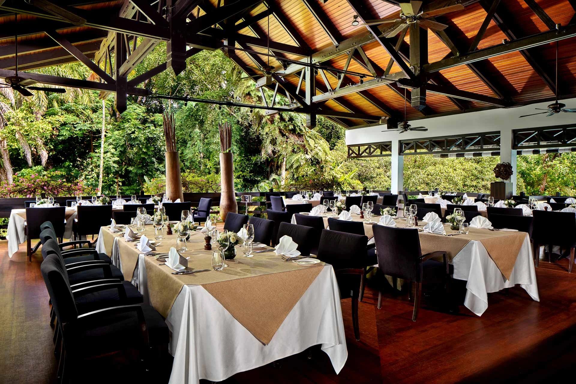 Arbenz restaurant day with timber trusses and tropical views