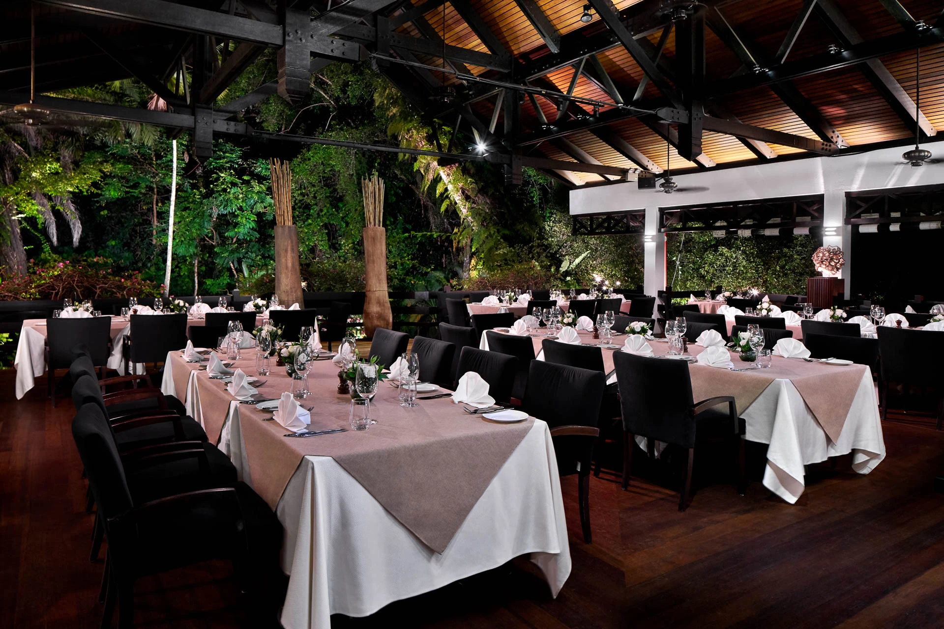 Arbenz restaurant at night with spotlit timber ceiling