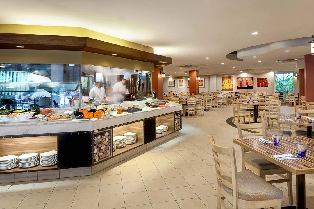 Wheelhouse restaurant with open kitchen, marble station and modern artwork