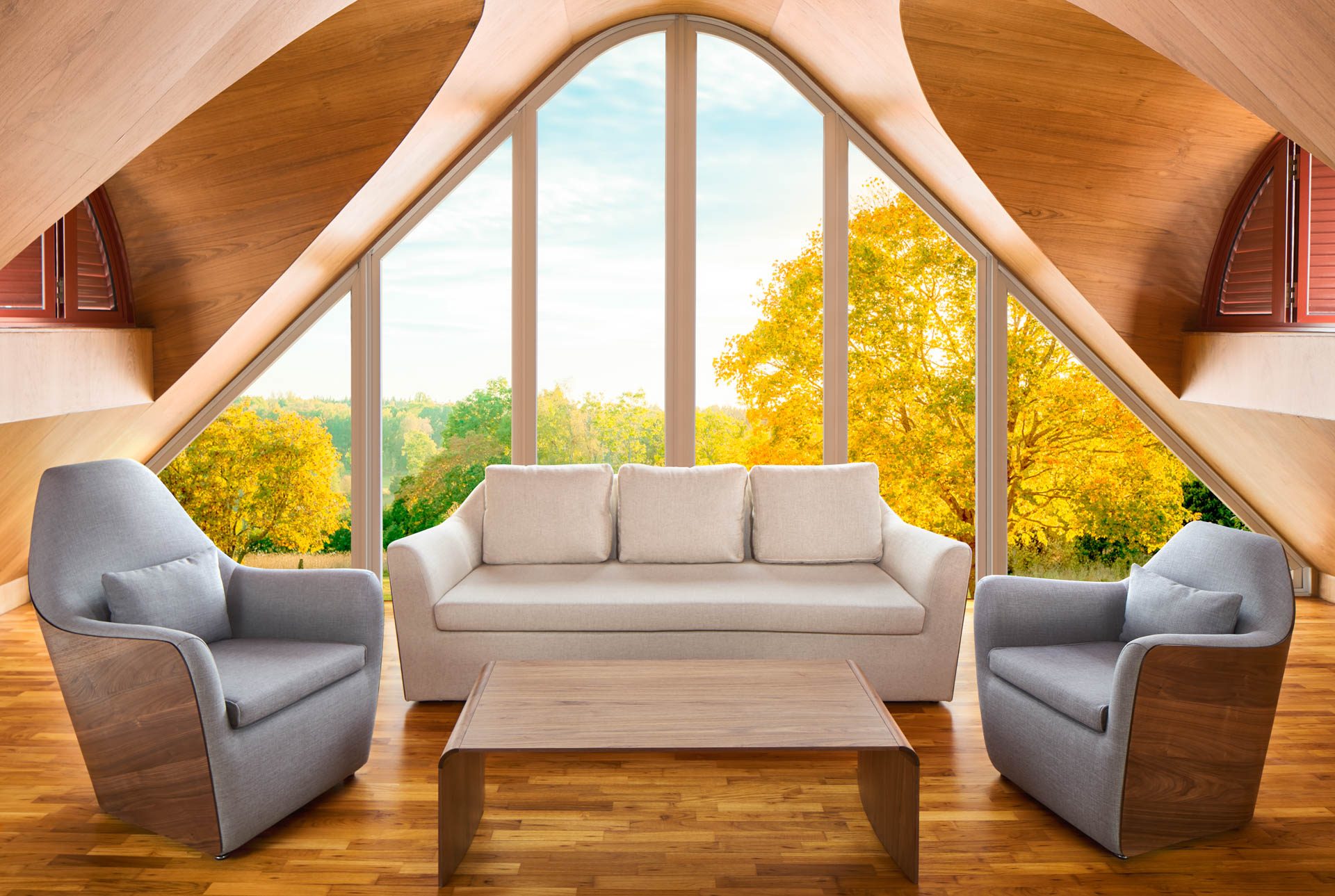 Attic sitting room with sculptural curved wood ceiling, white sofa flanked by grey armchairs, and large arched window framing autumn trees.