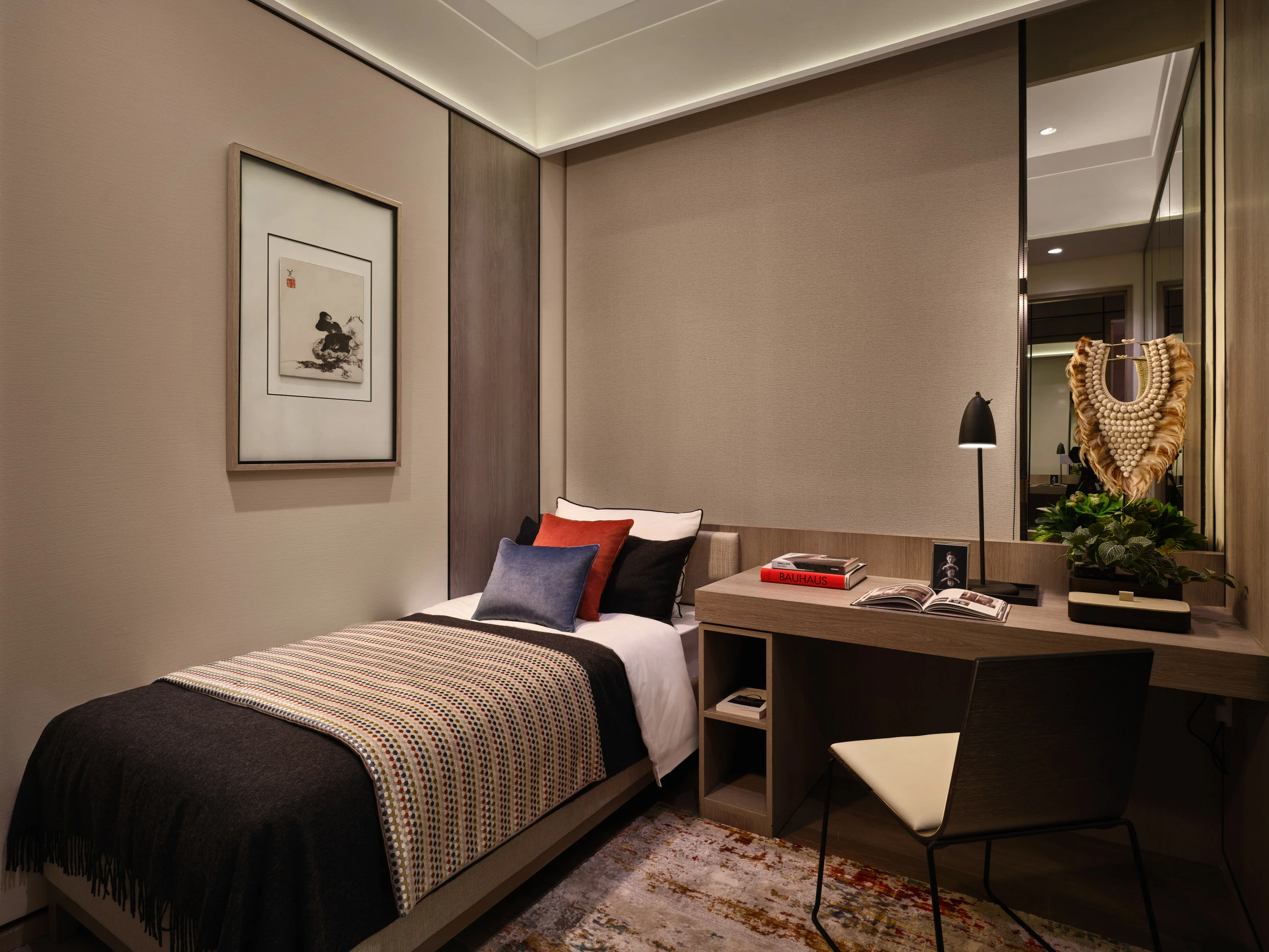 Modern guest bedroom with desk, fabric headboard, and soft neutral tones in Klimt Cairnhill 2-bedroom show suite