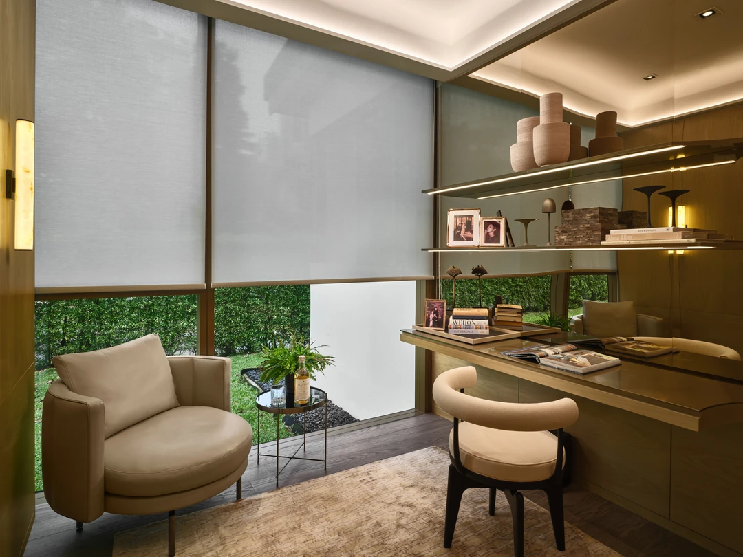 Home office with built-in desk, open shelving, and warm wood finishes in Klimt Cairnhill 3-bedroom showflat