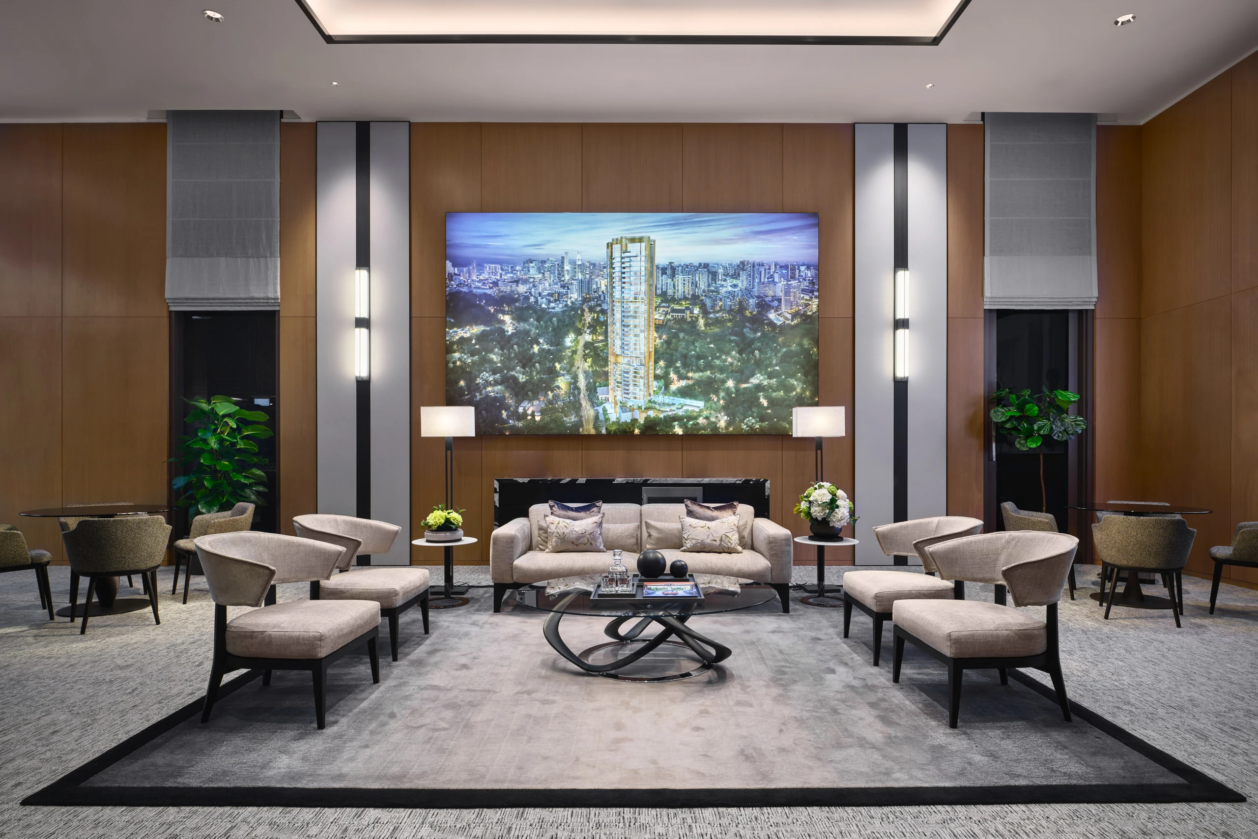 Luxury lounge area with contemporary decor, accent lighting, and panoramic city views in Klimt Cairnhill show suite