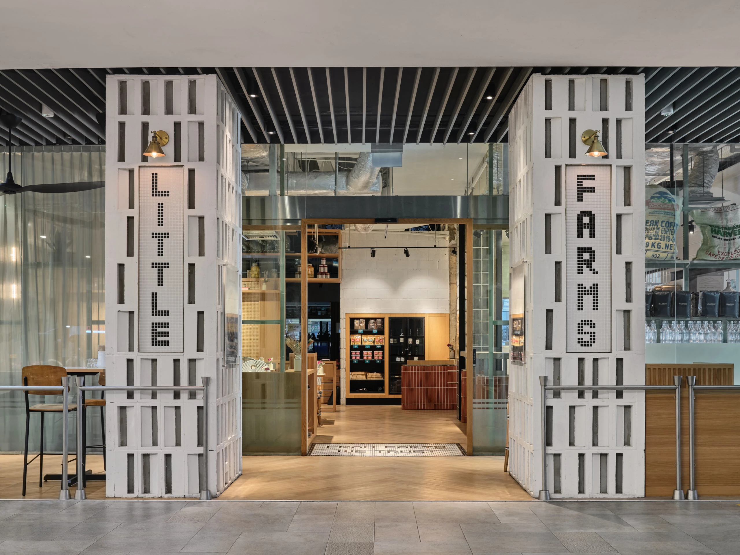 Main entrance with large glass doors and branded signage