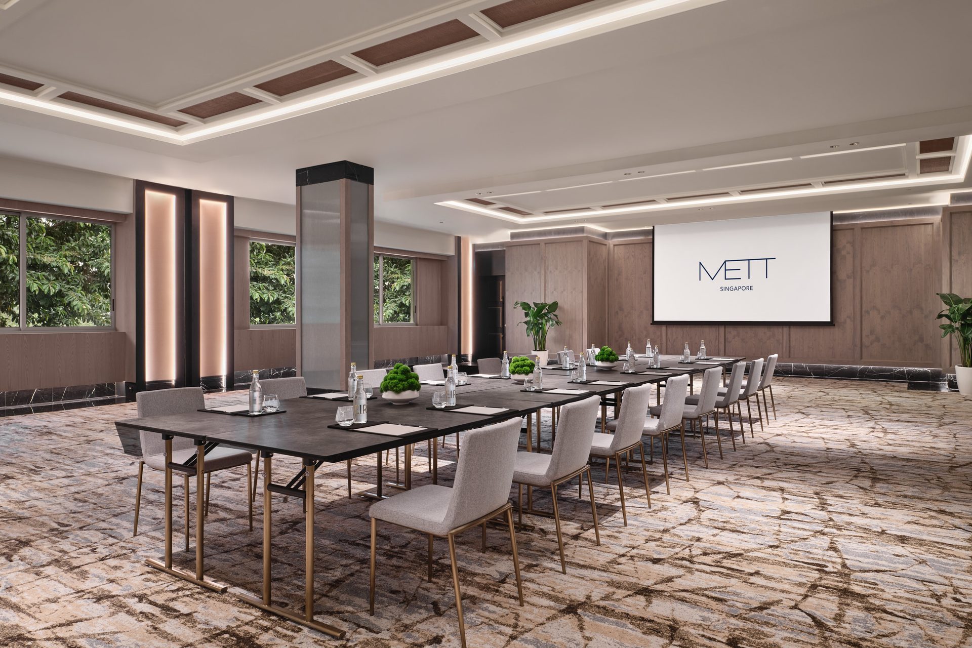 METT Singapore Junior Ballroom boardroom setup with long meeting tables, presentation screen, wood wall panels, and garden views
