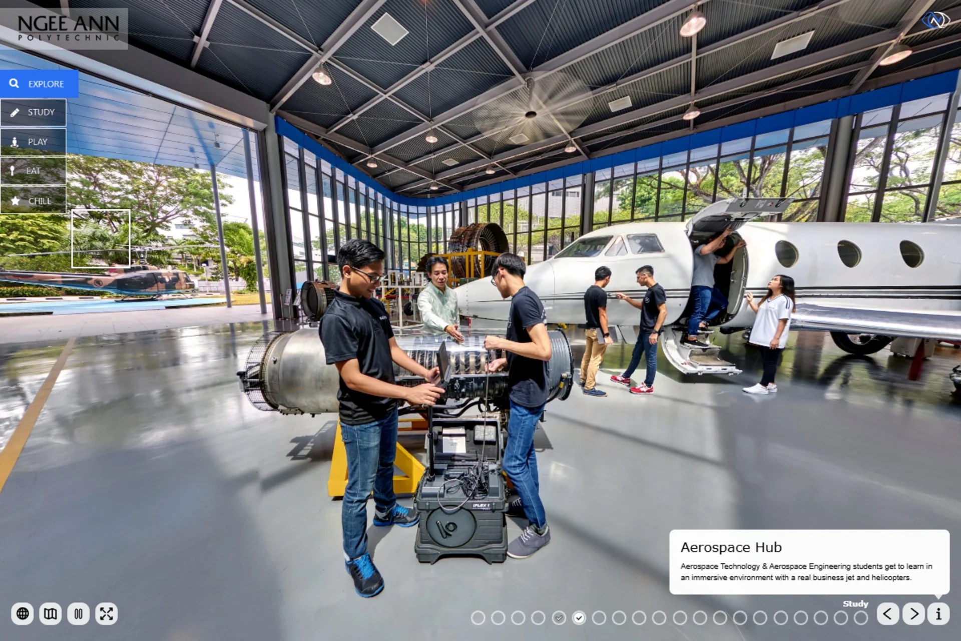 Students working with aircraft equipment inside the Aerospace Hub.