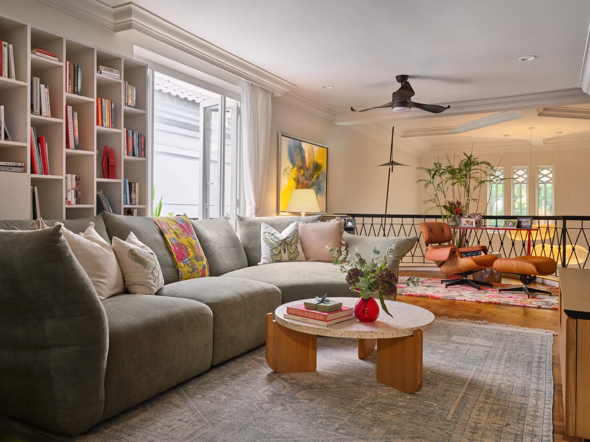Lounge with neutral sofa, wooden coffee table and colourful wall art