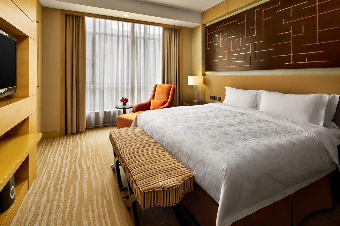 Senior suite bedroom with upholstered headboard — Crowne Plaza Ordos hotel photography