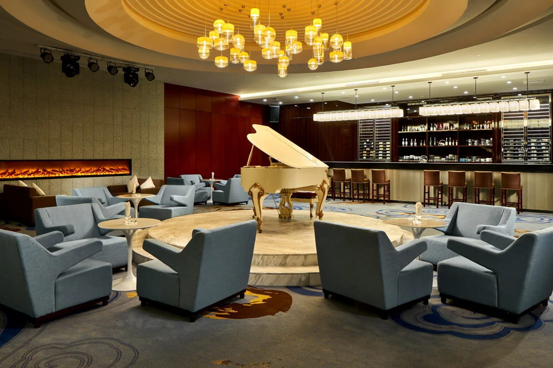 Maracaja wine bar with mood lighting and leather seating — Crowne Plaza Ordos restaurant photography