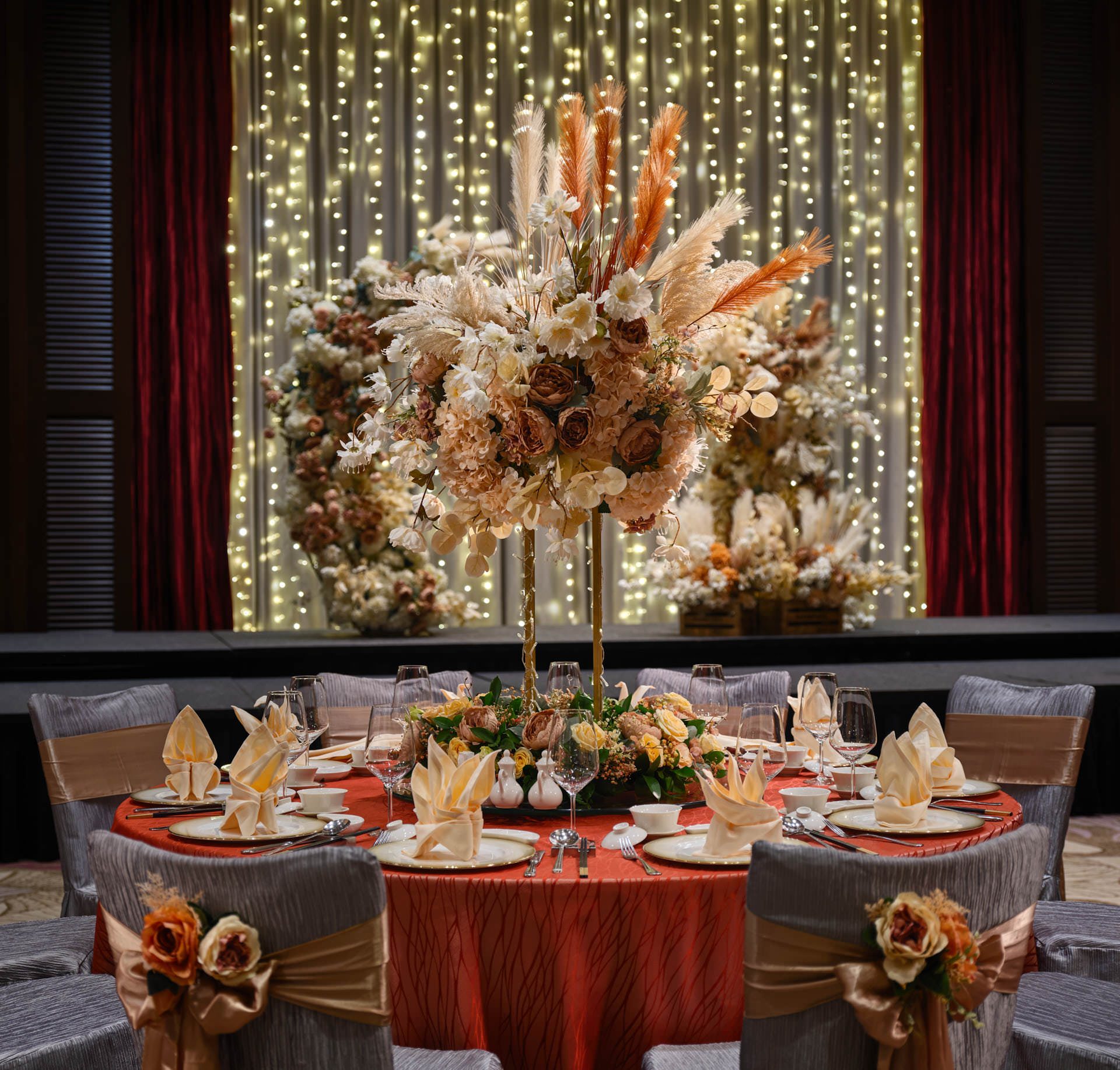 Paradox Singapore bohemian table setting with peonies, pampas grass, and gold charger plates