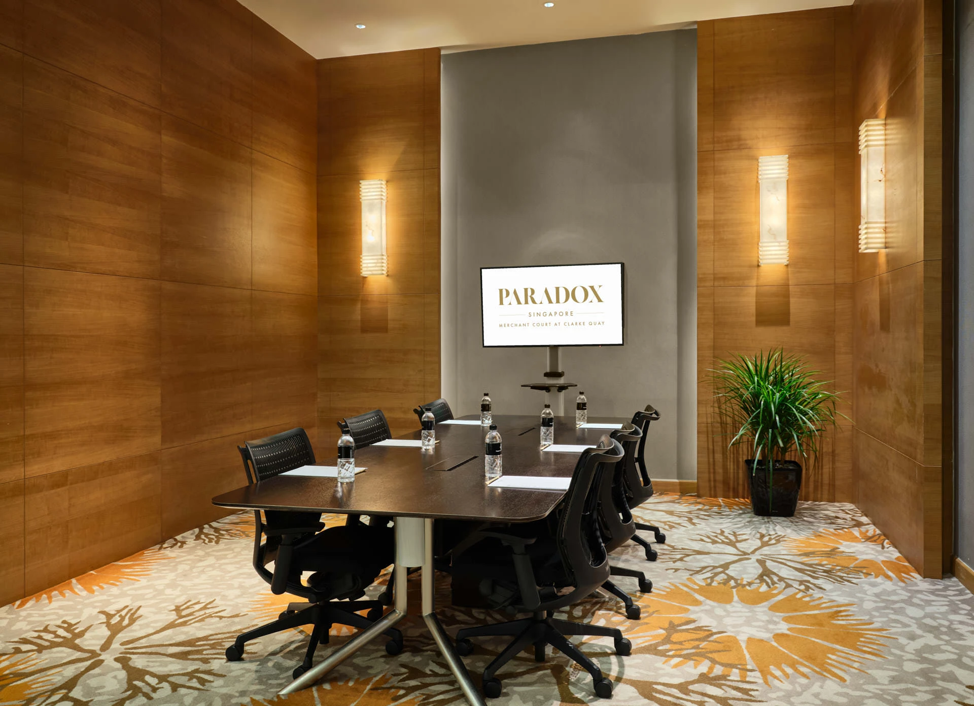 Paradox Singapore boardroom with Art Deco sconces and wood panelling