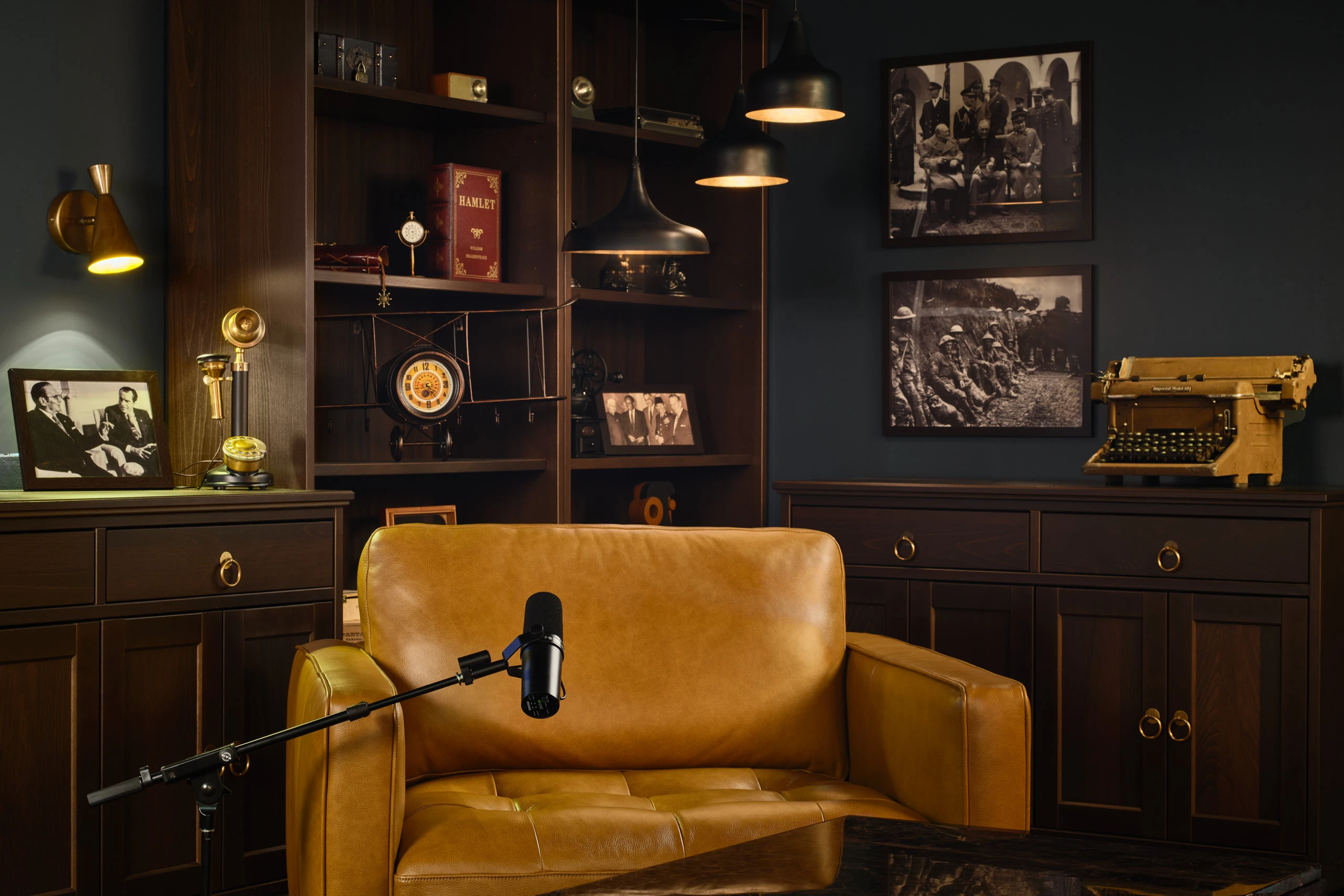 Library studio detail with cowhide rug, chest table and globe bookshelf