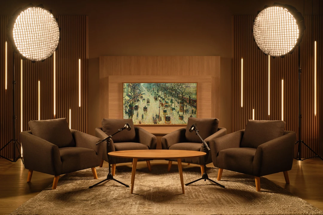 Mid-century modern podcast studio with wood slat panels and art display