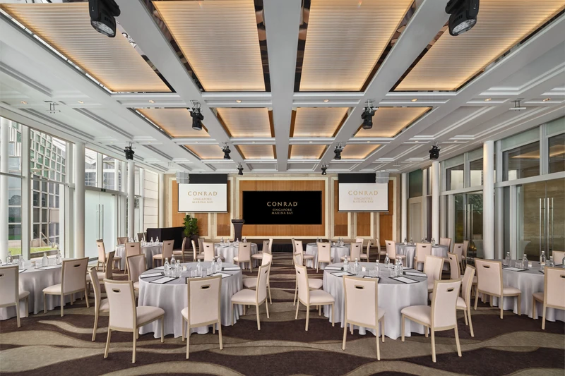 Conrad Singapore Marina Bay Pavilion in cluster setup with glass walls, garden views and bright hotel event seating