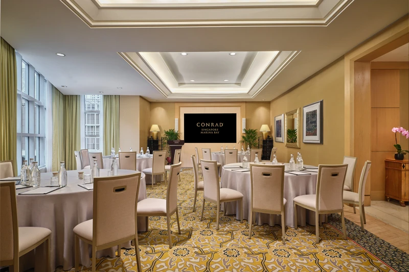 Conrad Singapore Marina Bay Salon 4 in cluster setup with intimate meeting room seating and soft hotel lighting