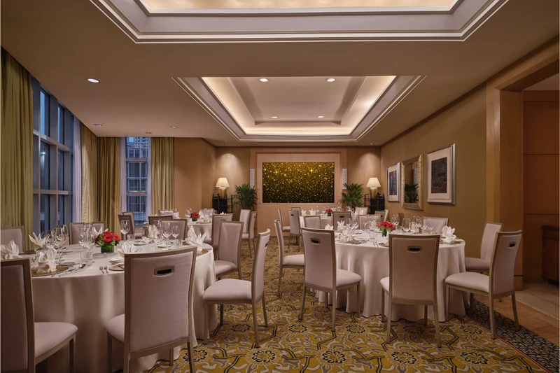Conrad Singapore Marina Bay Salon 4 in social event setup with intimate meeting room seating and soft hotel lighting