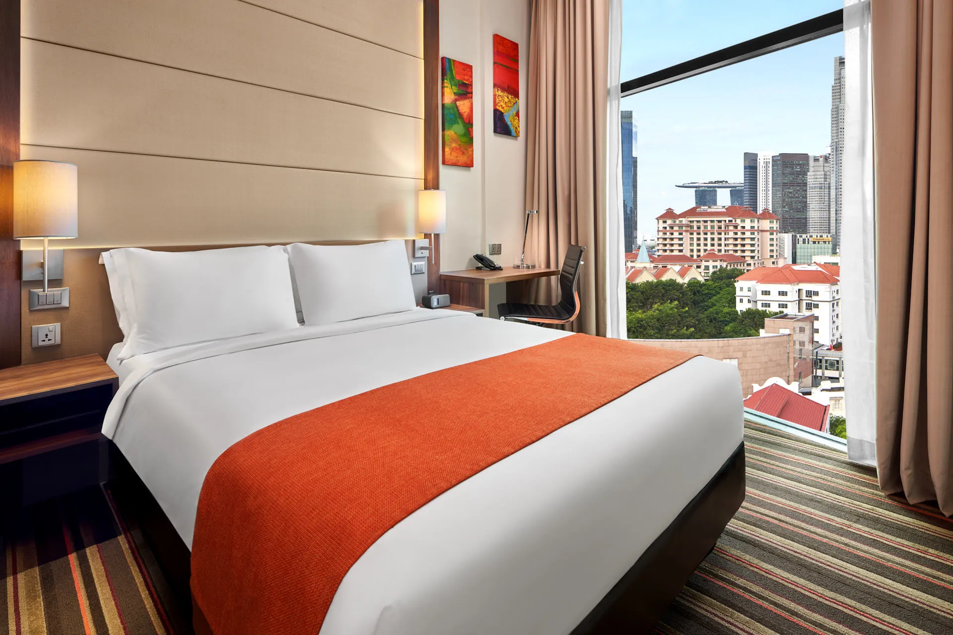 Queen room with orange runner and Marina Bay Sands skyline view — Holiday Inn Express Clark Quay hotel photography