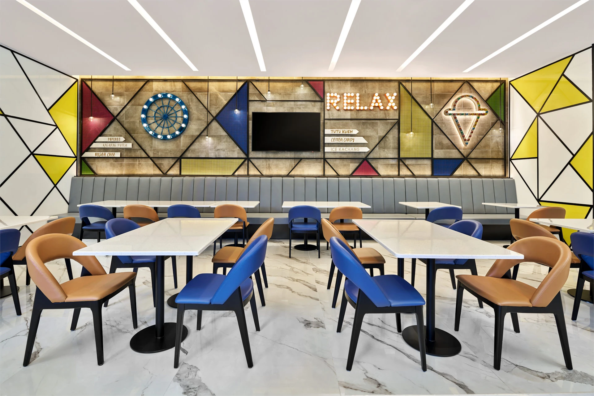 Carnival-themed dining wall with Ferris wheel motif and local food signage