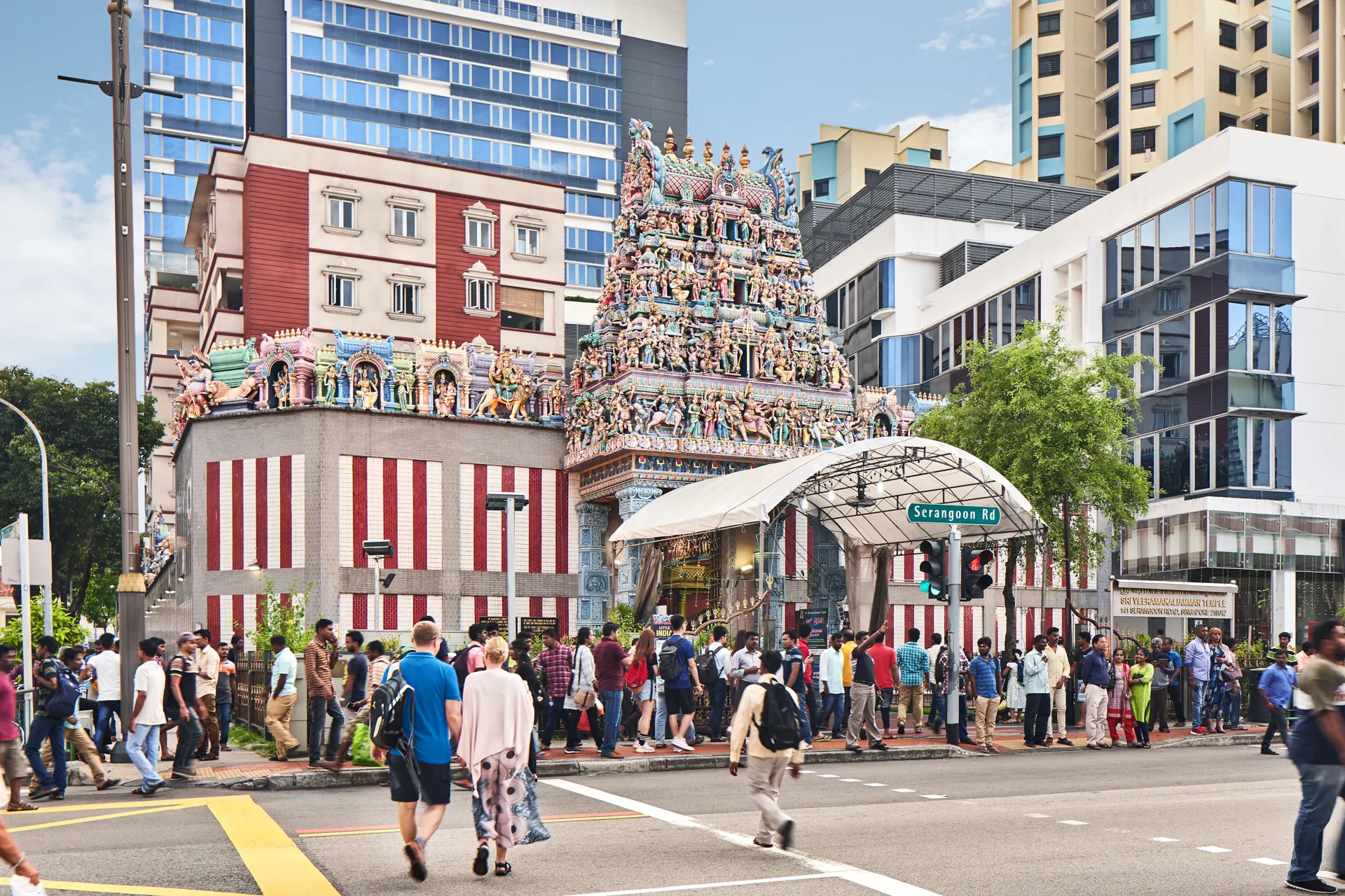 Sri Veeramakaliamman Temple on Serangoon Road with pedestrians and shophouses — Singapore architectural photography