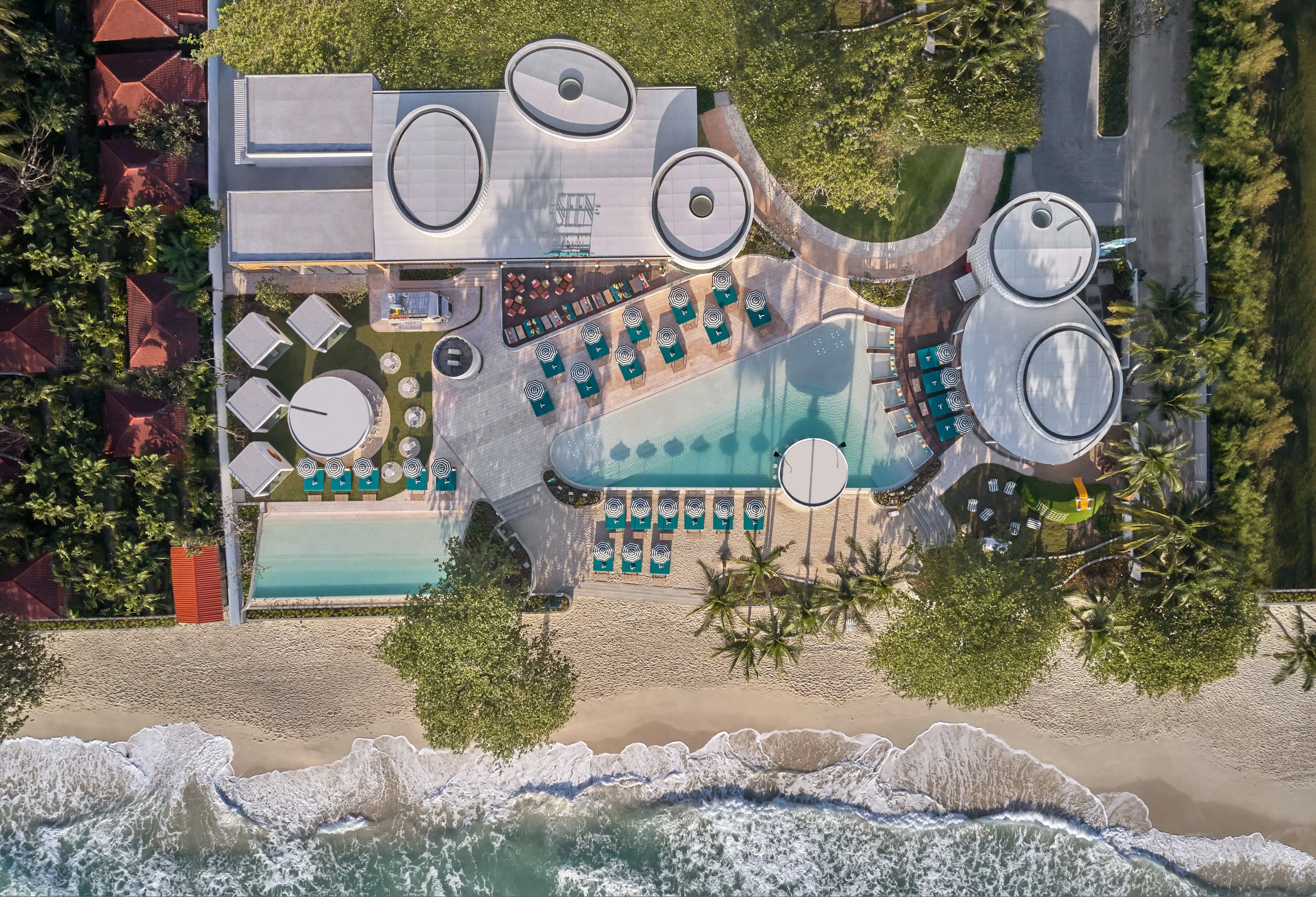 Seen Beach Club aerial showing pool, restaurant and beachfront