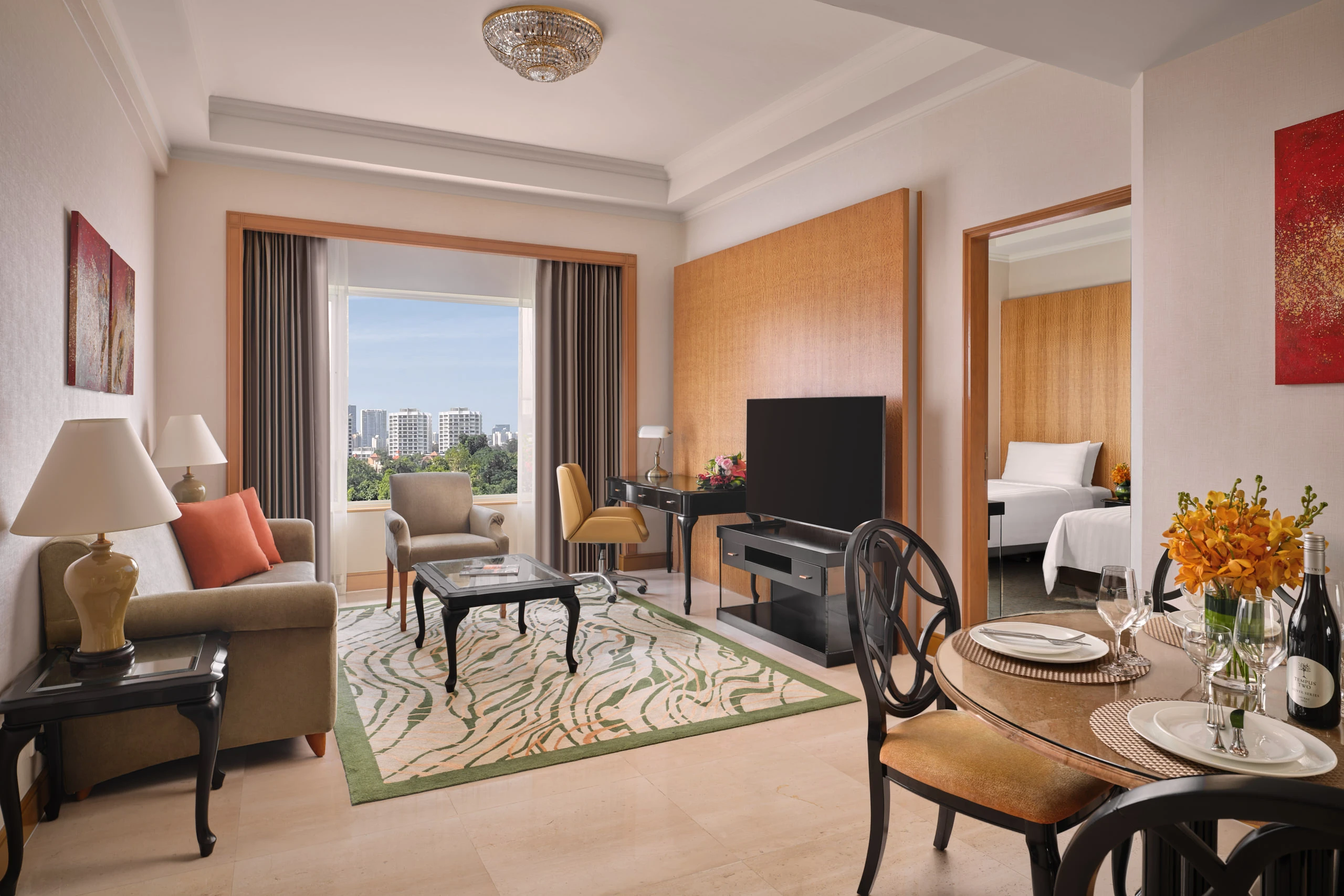 Suite living room with city view, dining area and bedroom access, Shangri-La Residences Singapore