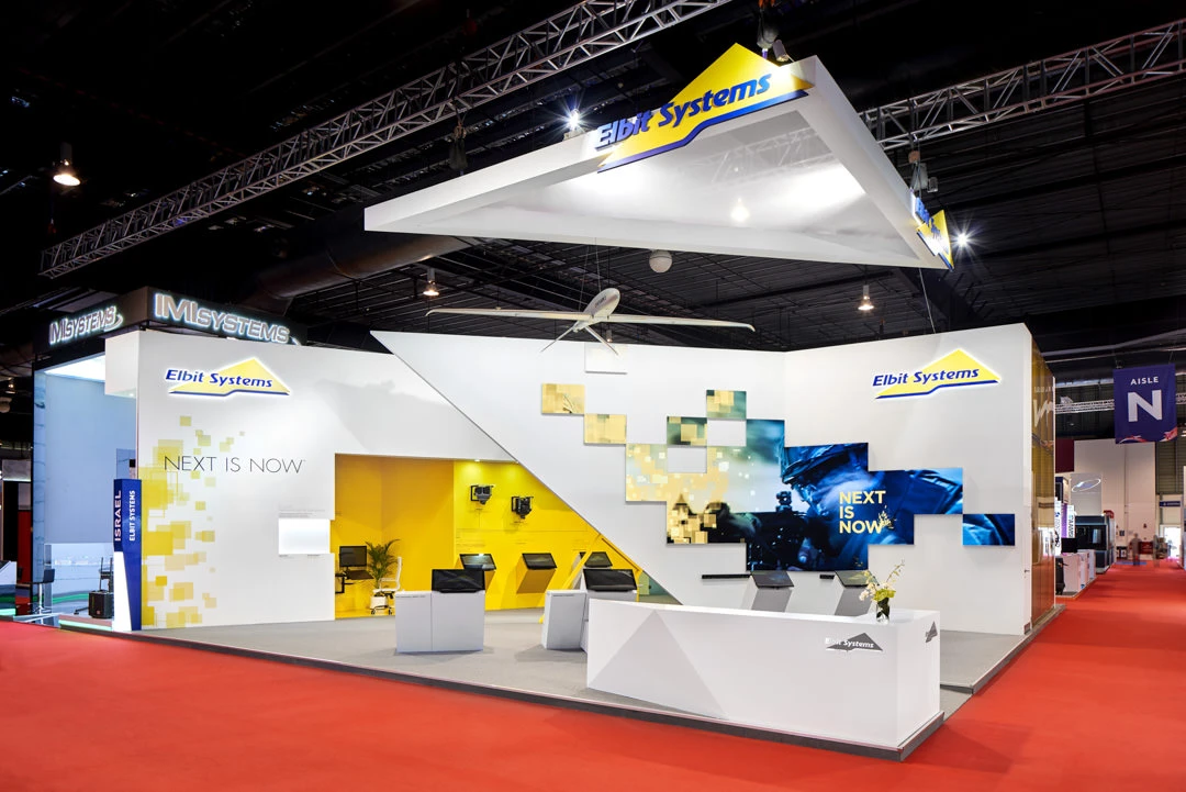 Elbit Systems booth exterior with drone model and illuminated canopy