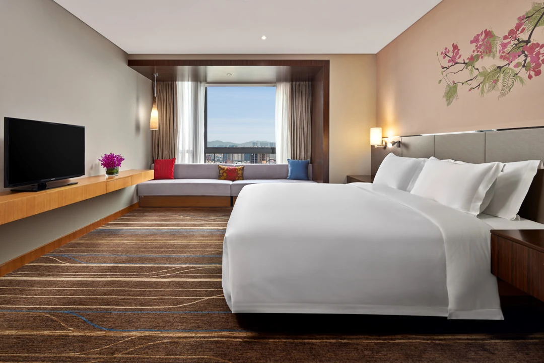 Suite king bedroom with cherry blossom mural and daybed