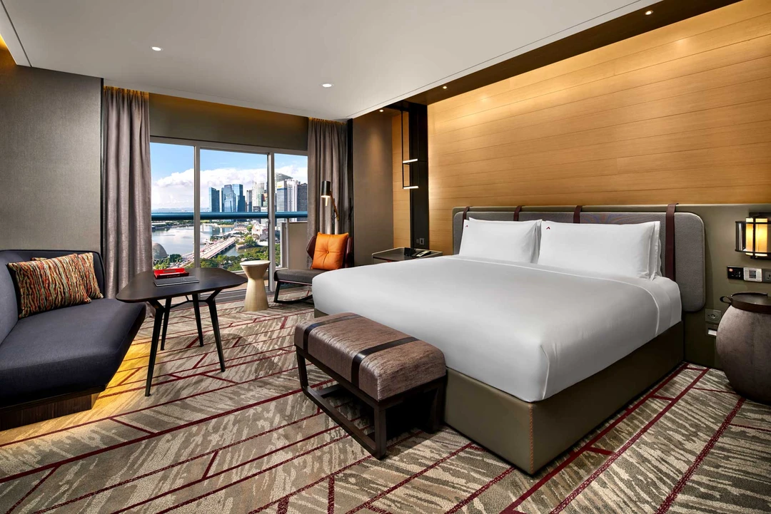King room with CBD skyline and harbour daylight view — Swissotel The Stamford Singapore hotel photography