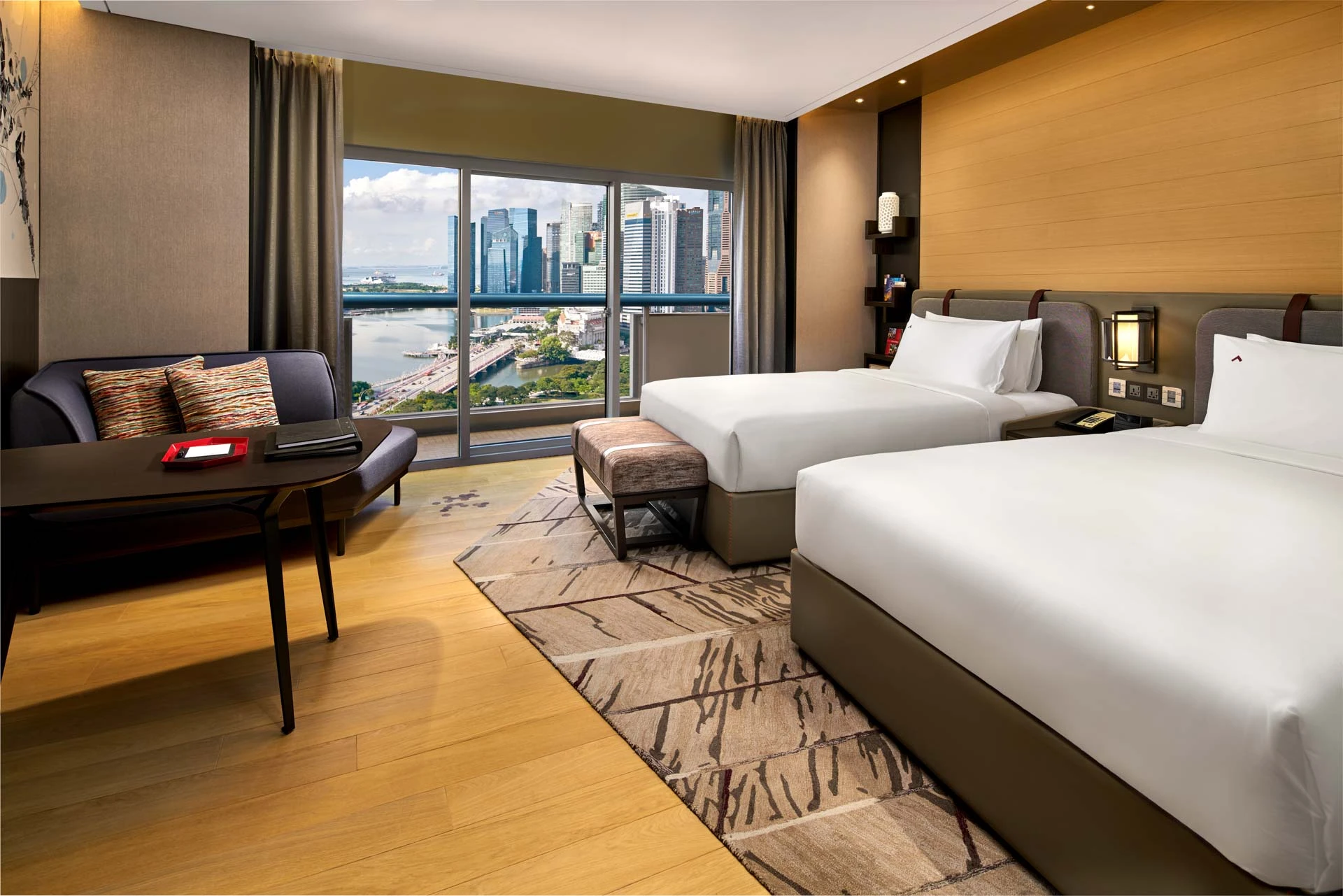 Twin room with harbour and skyline daylight view through large windows — Swissotel The Stamford Singapore hotel photography