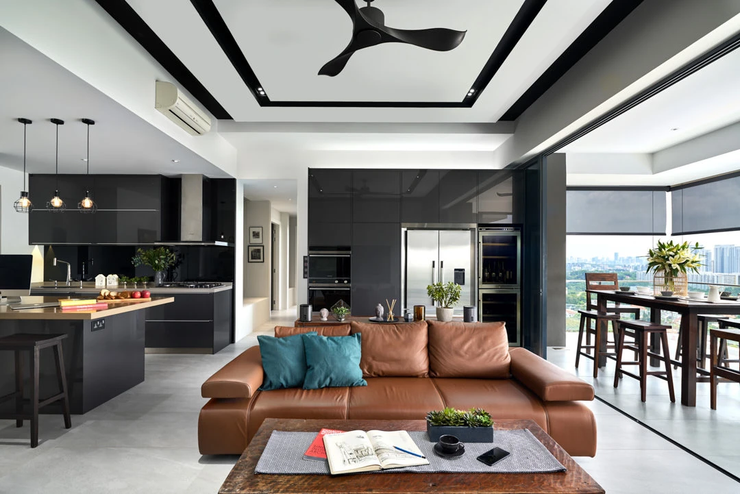 Penthouse living with cognac leather sofa, black kitchen and city views