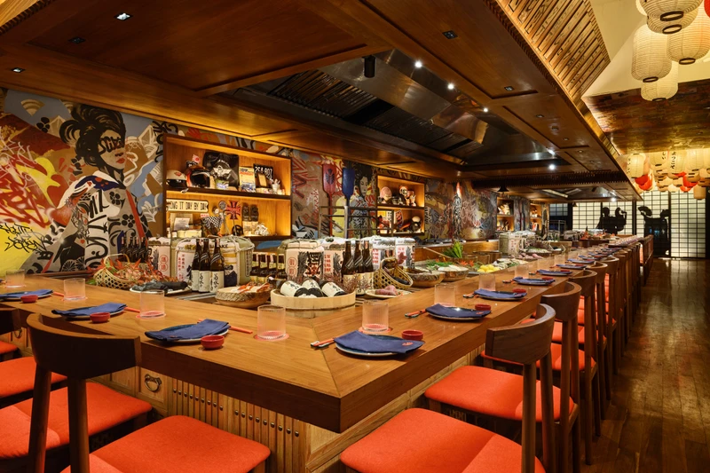 Upper floor overview with large paper lanterns and communal seating