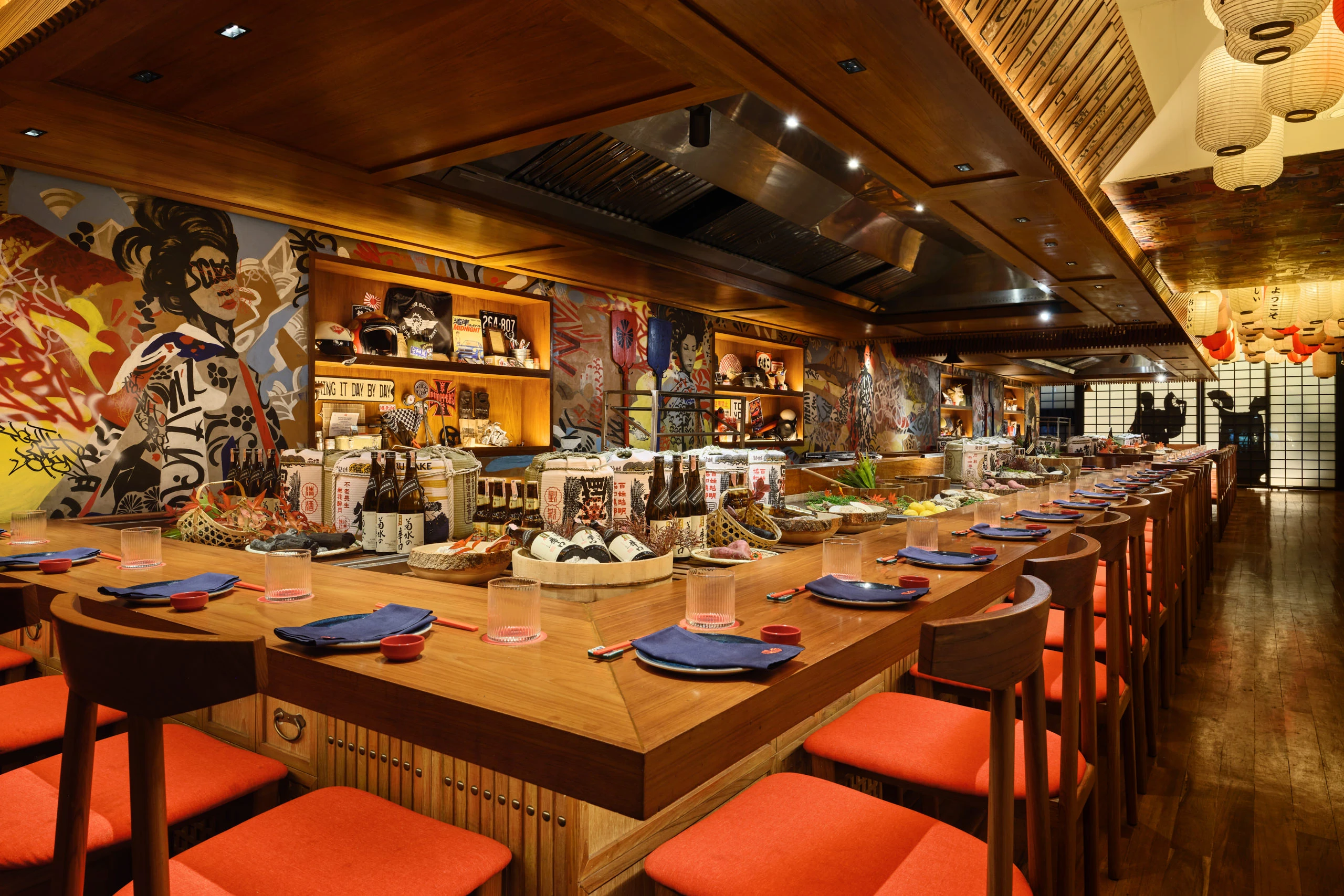 Upper floor overview with large paper lanterns and communal seating